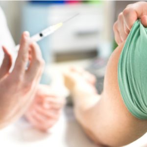 Person receiving a flu vaccination.